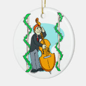 背景幕によって直立した低音を遊んでいる漫画の人 セラミックオーナメント (左)