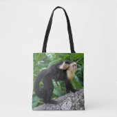 背部のベビーを運んでいる大人のCapuchin猿 トートバッグ (正面)