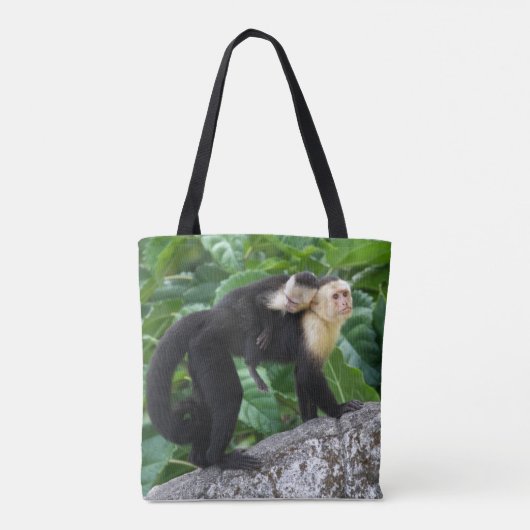 背部のベビーを運んでいる大人のCapuchin猿 トートバッグ (裏面)