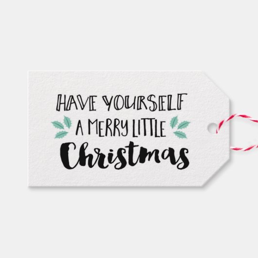 自分に小さなメリークリスマスギフトタグを持っている ギフトタグ (正面(横))