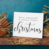 自分に小さなメリークリスマスサインを持っている フォトプラーク (側面)