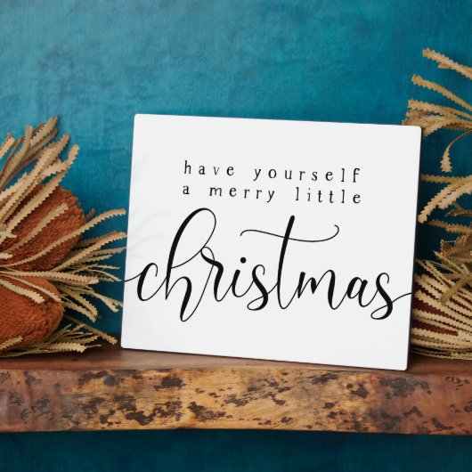 自分に小さなメリークリスマスサインを持っている フォトプラーク (側面)