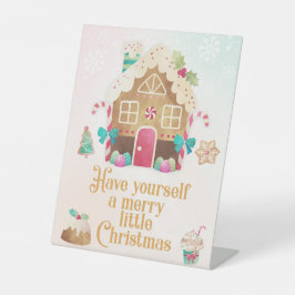 自分に小さなメリークリスマスサインを持っている 台座サイン