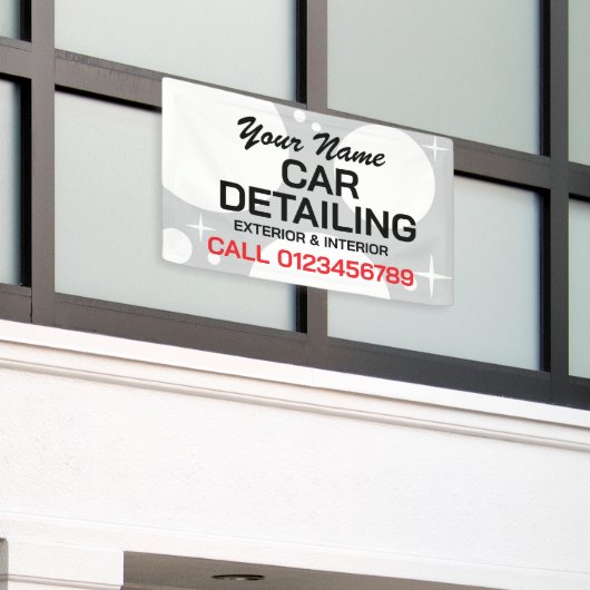 自動車洗浄事業の詳細を広告示す車 横断幕 (ビルの外側)