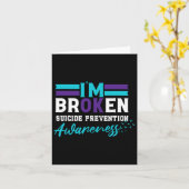 自殺防止認識度ティール（緑がかった色）とP カード (黄色い花)