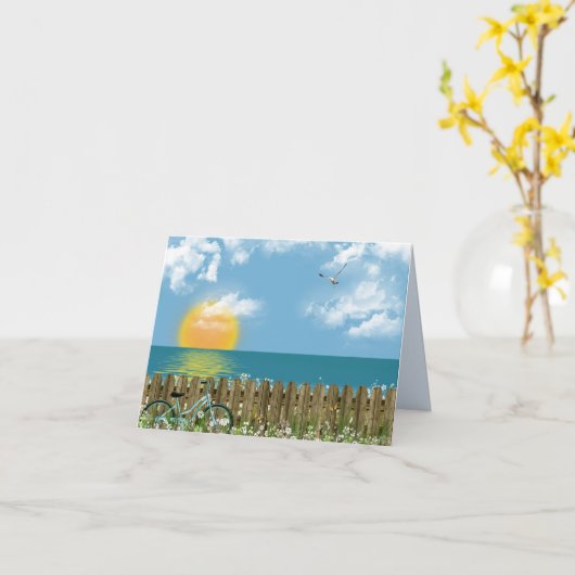 自転車でフェンスに寄り掛かるビーチ カード (黄色い花)