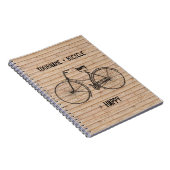 自転車と幸せで旧式な木製ベージュ色に匹敵します ノートブック (右側)