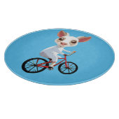 自転車に乗ったかわいい小さな白いヤギ カッティングボード (角)