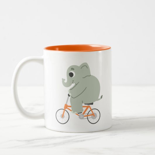 自転車に乗った小さな象 ツートーンマグカップ (左)
