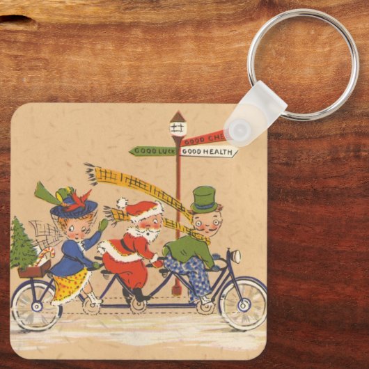 自転車に乗るサンタクロース、ビンテージクリスマス キーホルダー (裏面)