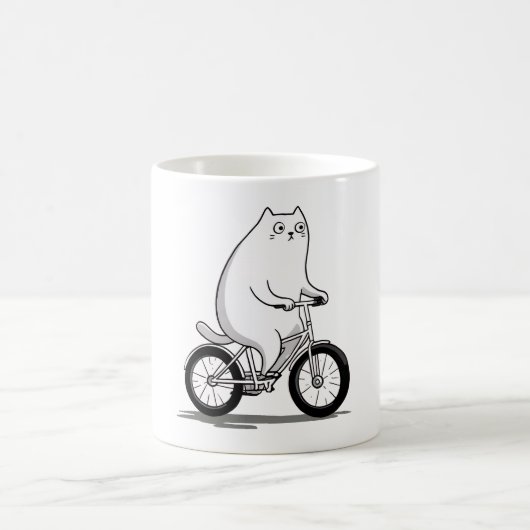 自転車の漫画に乗ってかわいい丸っぽい猫 コーヒーマグカップ (中央)