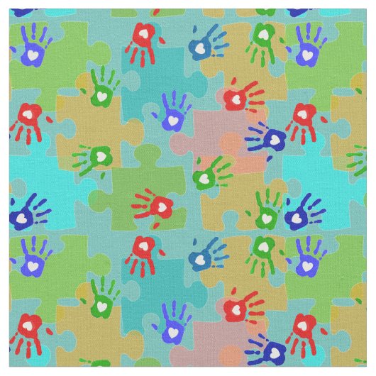 自閉症の認識度の子供手のパズルの部分 ファブリック (クローズアップ)