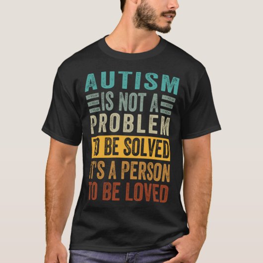 自閉症は解決すべき問題ではなくひとりの人です Tシャツ (正面)