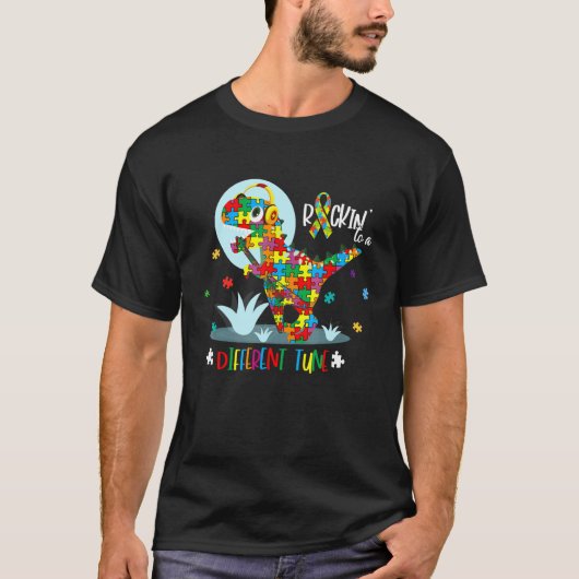 自閉症啓発、別のリズムで踊る恐竜ロック Tシャツ (正面)