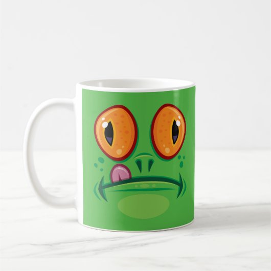 舌を出したカエルの顔のキャラクター コーヒーマグカップ (左)