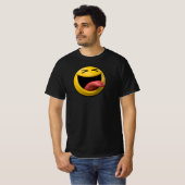 舌を出した斜視の顔のスマイリー絵文字 Tシャツ (正面フル)
