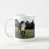 舌を突き出ている牛 コーヒーマグカップ (左)