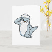船の男の子としてサルの帽子をかぶったアザラシ カード (黄色い花)