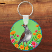 色とりどりの花々に囲まれた鳥 キーホルダー (正面)