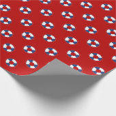 色の背景上の青い救命具 ラッピングペーパー (角)