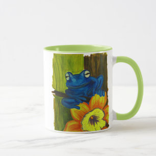 花およびツリーブランチでリラックスしている青いカエル マグカップ