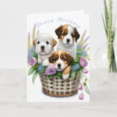 花かごに入ったかわいい子犬のバースデー カード (正面)