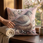 花とオリーブの枝に囲まれたピンクの鳩の巣 クッション