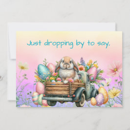 花と卵でいっぱいのトラックに乗ったかわいいイースターバニー シーズンカード