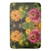 花のオレンジとピンクのジニア バスマット (正面縦)