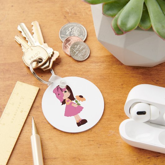 花のキーチェーンを持つ女の子 キーホルダー