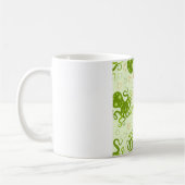 花の付いた緑のタコ コーヒーマグカップ (左)