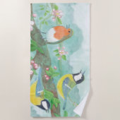 花の咲く木の枝で鳥が歌う ビーチタオル (正面)