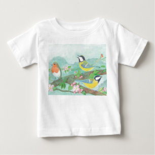 花の咲く木の枝で鳥が歌う ベビーTシャツ