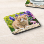 花の庭で可愛いジンジャーキャットキットンの写真 –  コースター (左側)