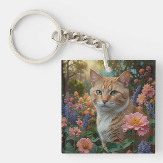 花の庭にいるかわいい白オレンジの猫 キーホルダー (正面)