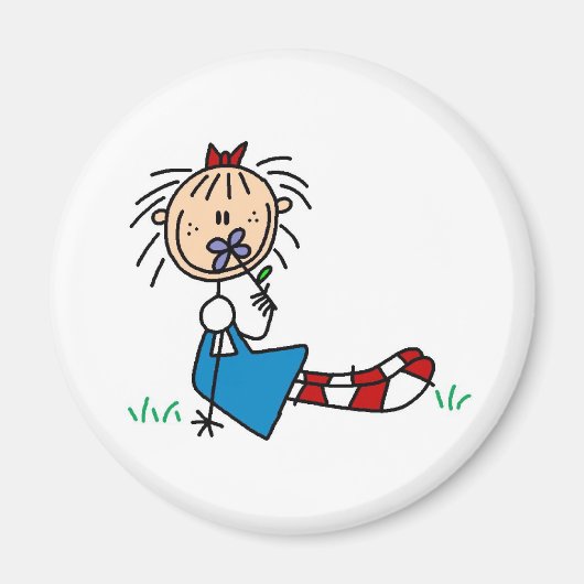 花の磁石で草の中に横たわるアニー マグネット (正面)