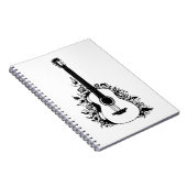 花の背景にアコースティックギター。 ノートブック (右側)