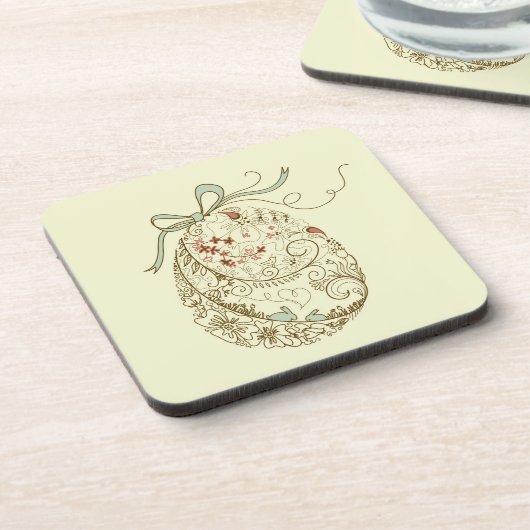 花の要素が付いているイースターエッグ コースター (左側)