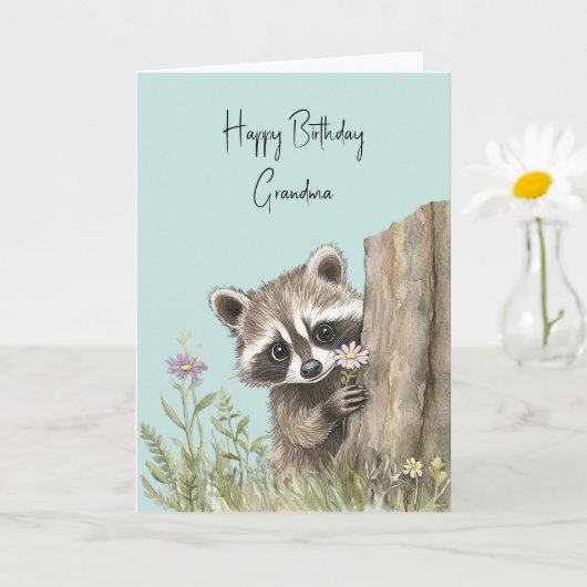花を持つアライグマの誕生日 カード (小さな植物)