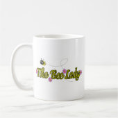 花を持つ蜂の女性 コーヒーマグカップ (左)