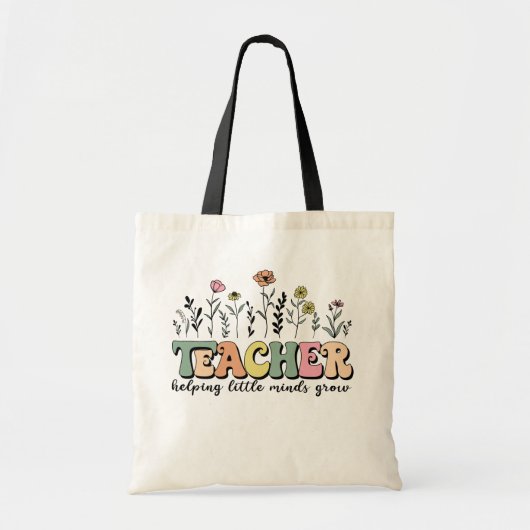花を添えた「Teacher Helping Little Minds Grow」 トートバッグ (正面)