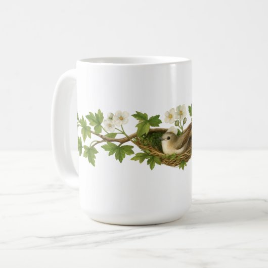花咲く枝の上の鳥の巣の中の鳥 コーヒーマグカップ (正面左)