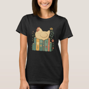 花柄の本の上の眠るニワトリ Tシャツ