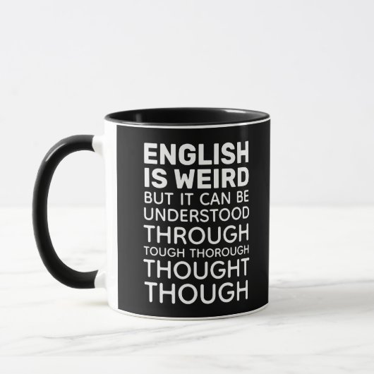英語は風変わり文法おもしろい黒 マグカップ (左)