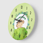 茂みの背後から見るかわいいサル ラージ壁時計 (傾斜)