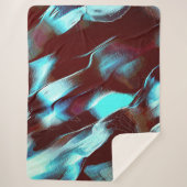 茶色からシアンのグラデーションで彫られた化石または金属 シェルパブランケット (正面)