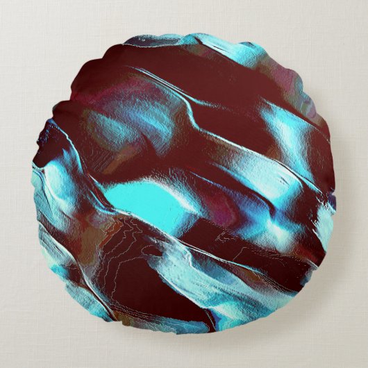 茶色からシアンのグラデーションで彫られた化石または金属 ラウンドクッション (正面)