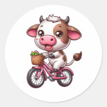 茶色と白の牛が自転車に乗っている