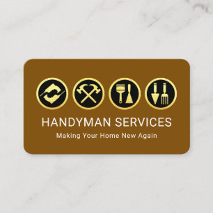 茶色の台紙の上の金色の便利屋グッズ 名刺