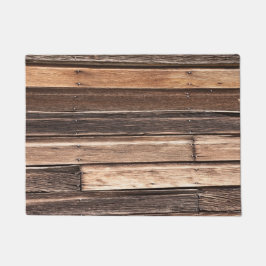 茶色の多くの色合いの水平風化木材 ドアマット